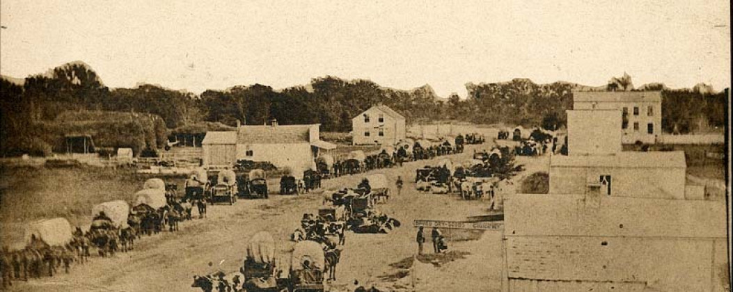 Covered wagons, Manhattan, Kansas, 1860, this photograph was taken by an unknown photographer in 1860, Courtesy of Kansas State Historical Society, https://www.kansasmemory.gov/item/413