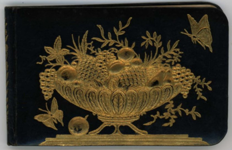 Bischoff family autograph book cover, black background with gold fruit basket